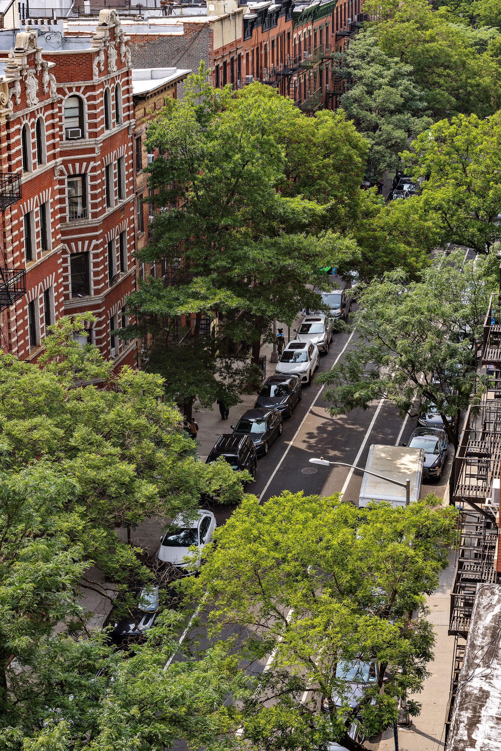 201 West 16th Street, Unit 9A Manhattan, NY 10011 - Photo 13 of 14 a backyard of a multi story building with yard and outdoor seating