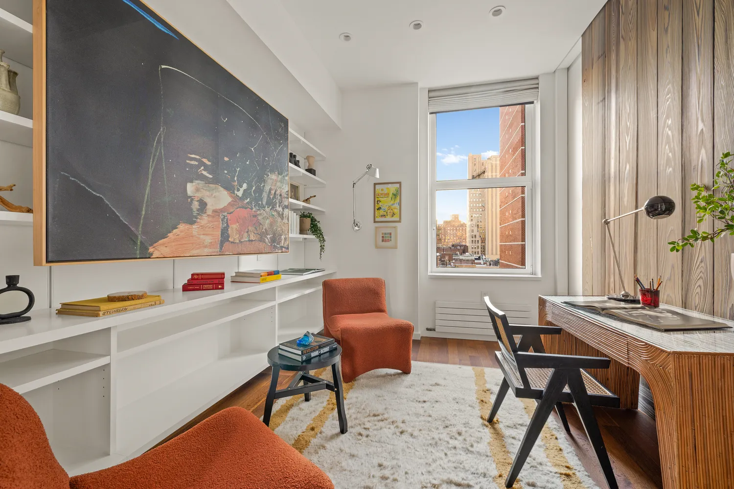 a work room with furniture and window