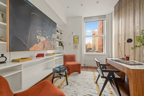 a work room with furniture and window