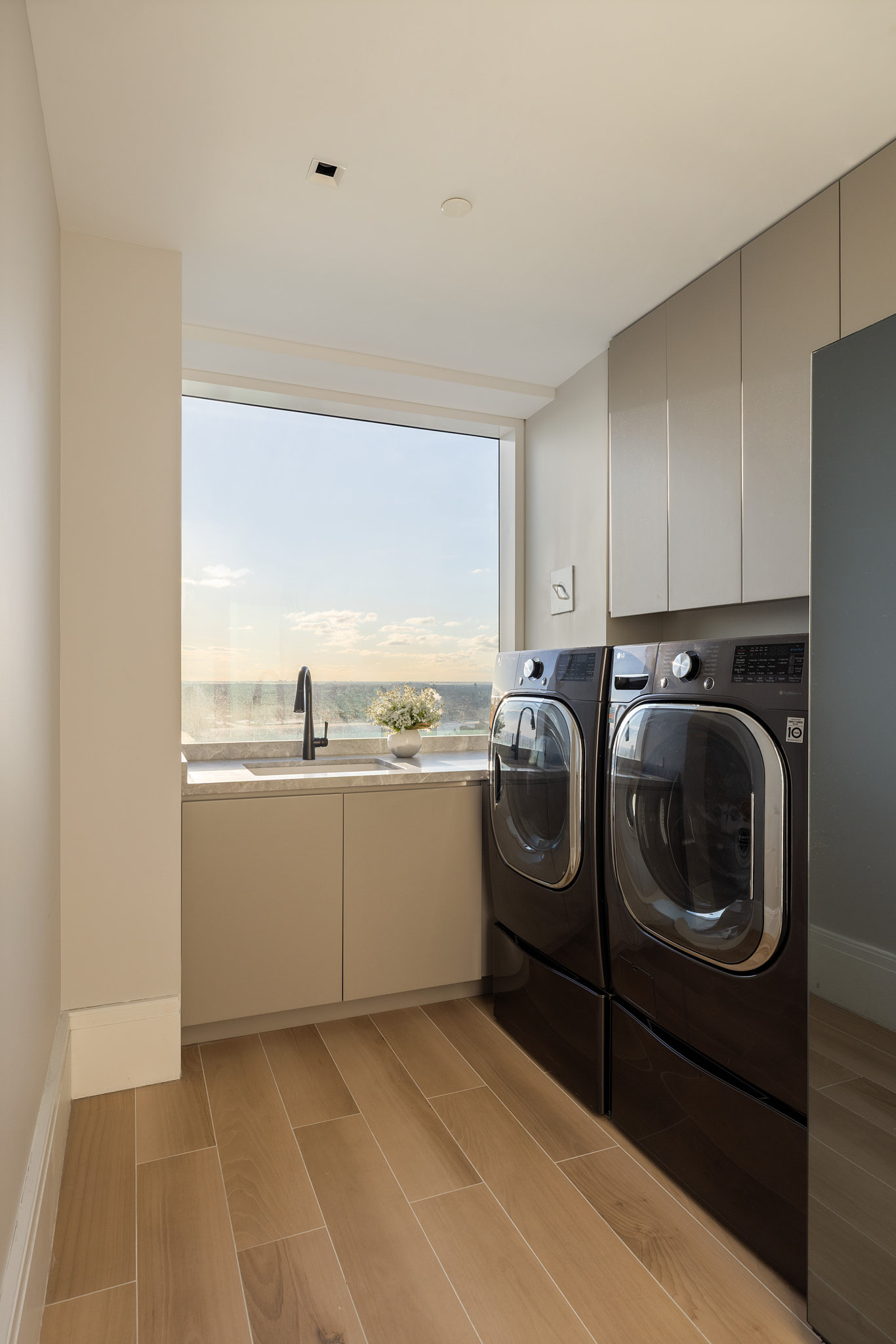 45 East 22nd Street, Unit 52/53B Manhattan, NY 10010 - Photo 18 of 27 a utility room with sink dryer and washer