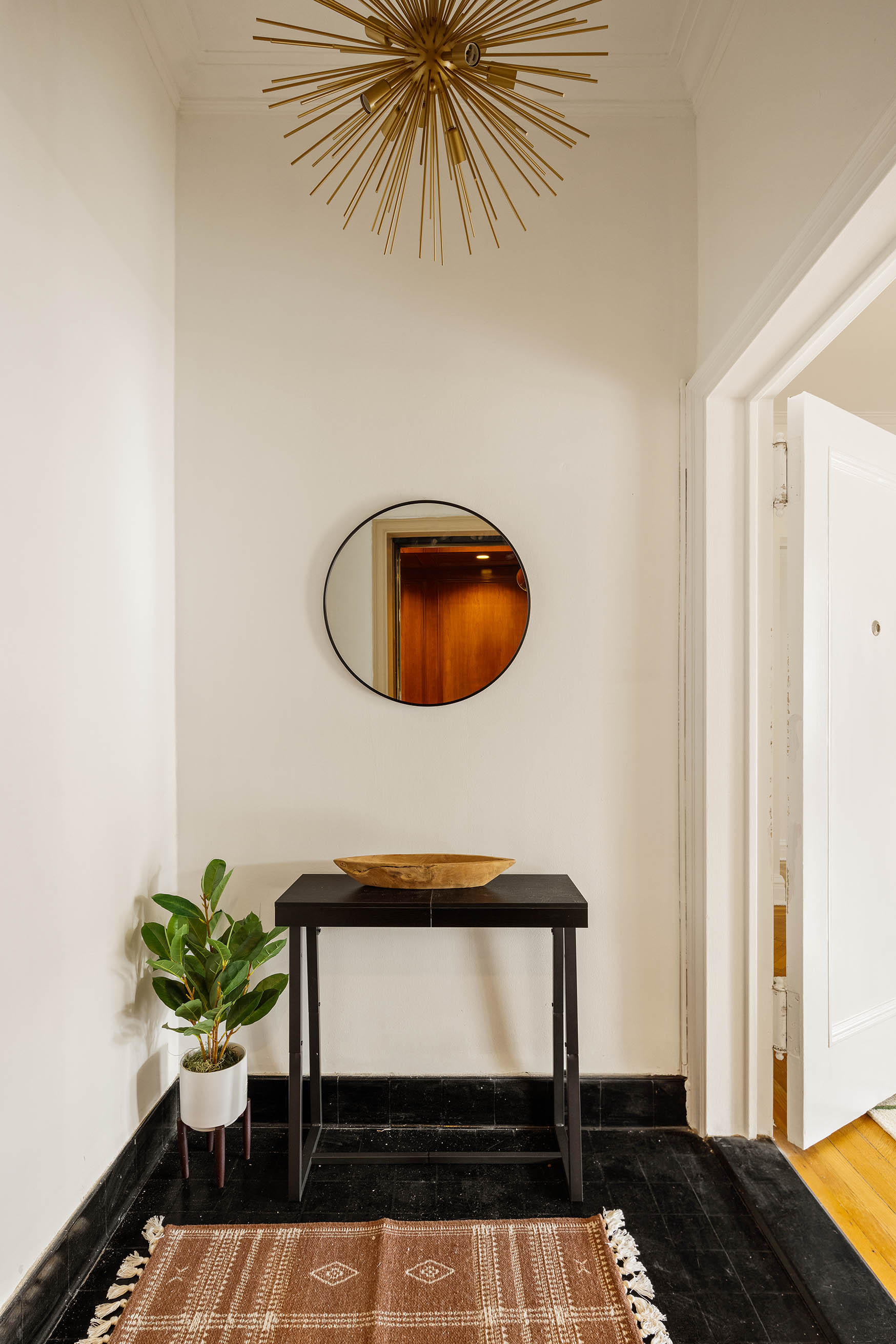 1100 Park Avenue, Unit 14B Manhattan, NY 10128 - Photo 9 of 14 a living room with furniture and a potted plant