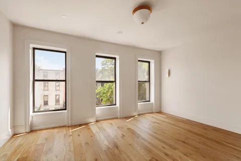 a bathroom with a sink mirror toilet and shower