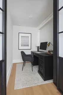 a workspace with furniture and window