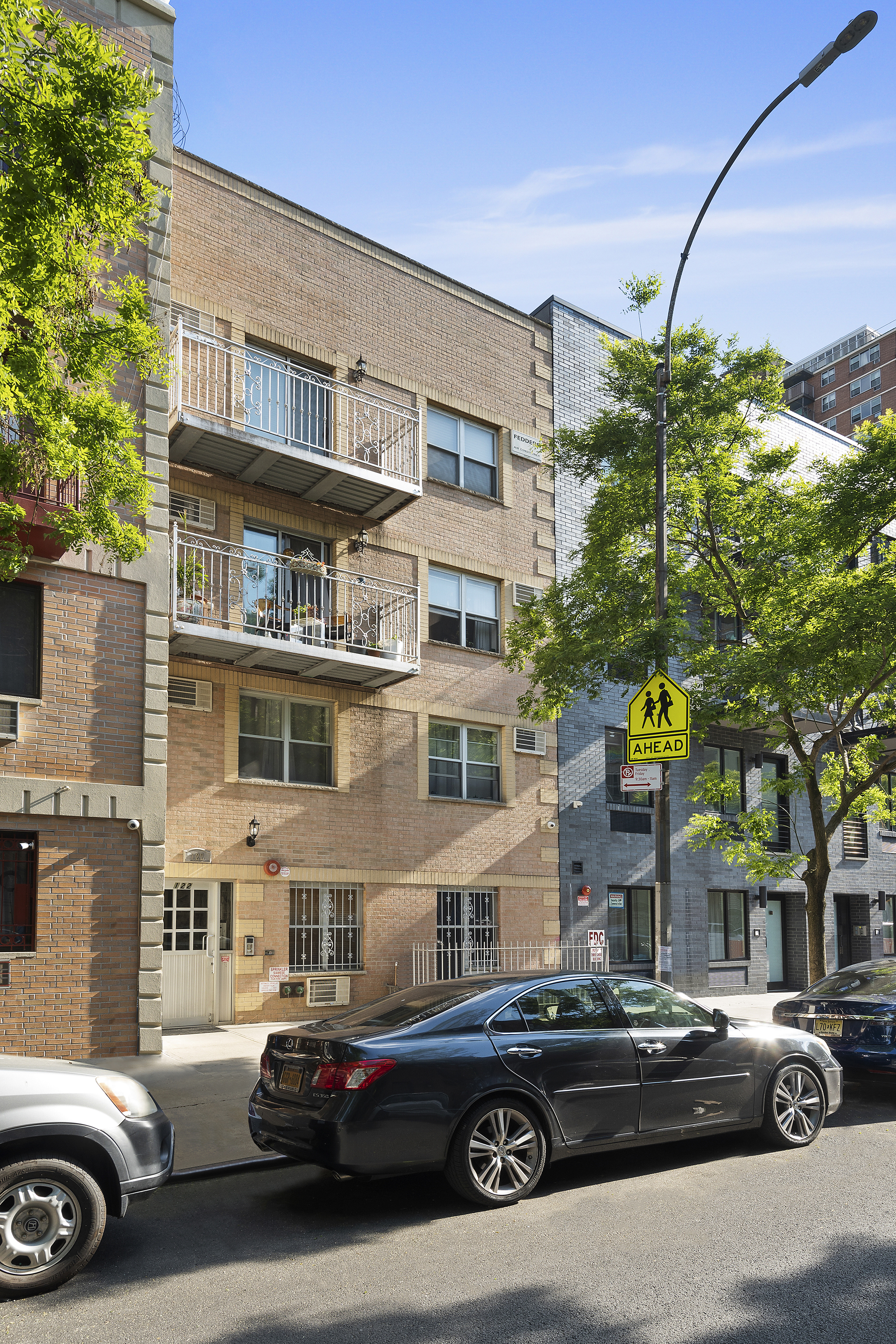 122 Boerum Street, Unit 4R Brooklyn, NY 11206 - Photo 8 of 9 a car parked in front of a building