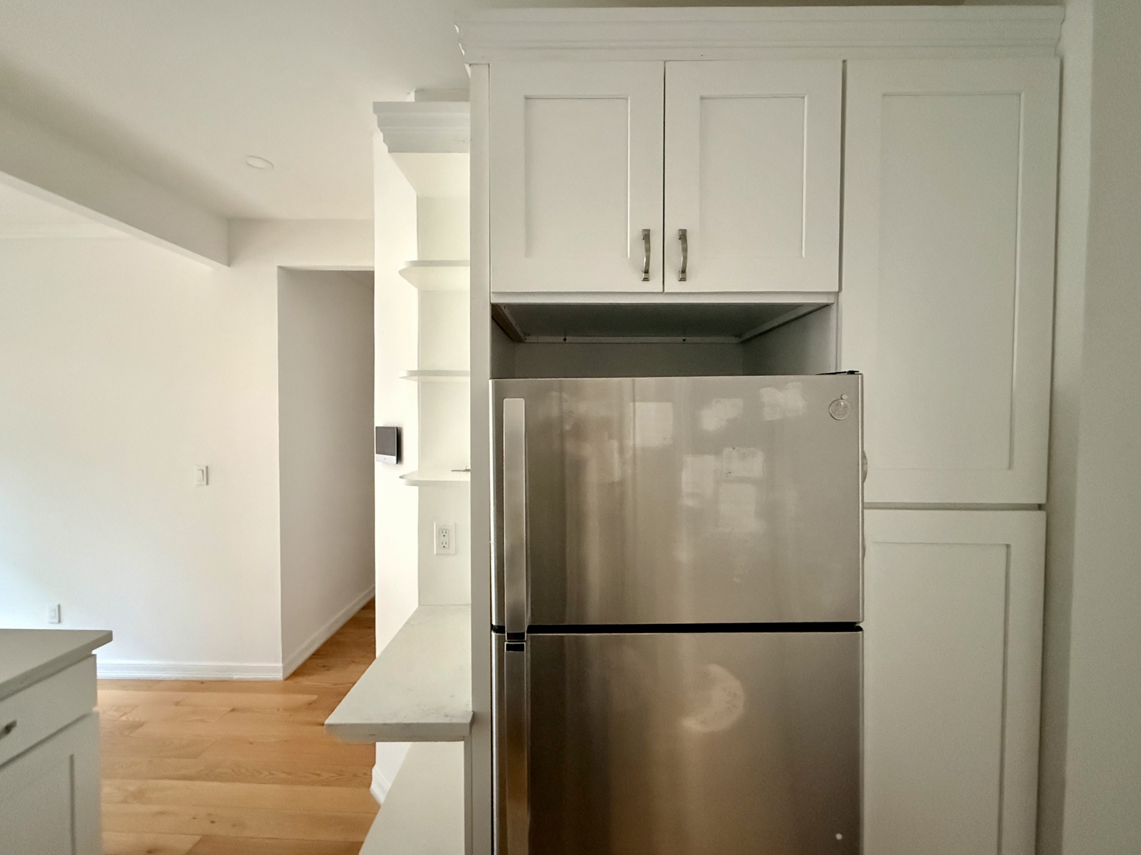 573 6th Street Brooklyn, NY 11215 - Photo 4 of 11 a white refrigerator freezer and a stove sitting inside of a kitchen