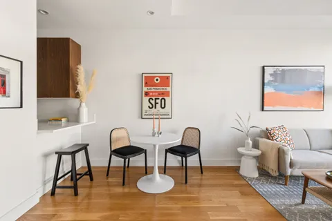 a living room with furniture and a rug