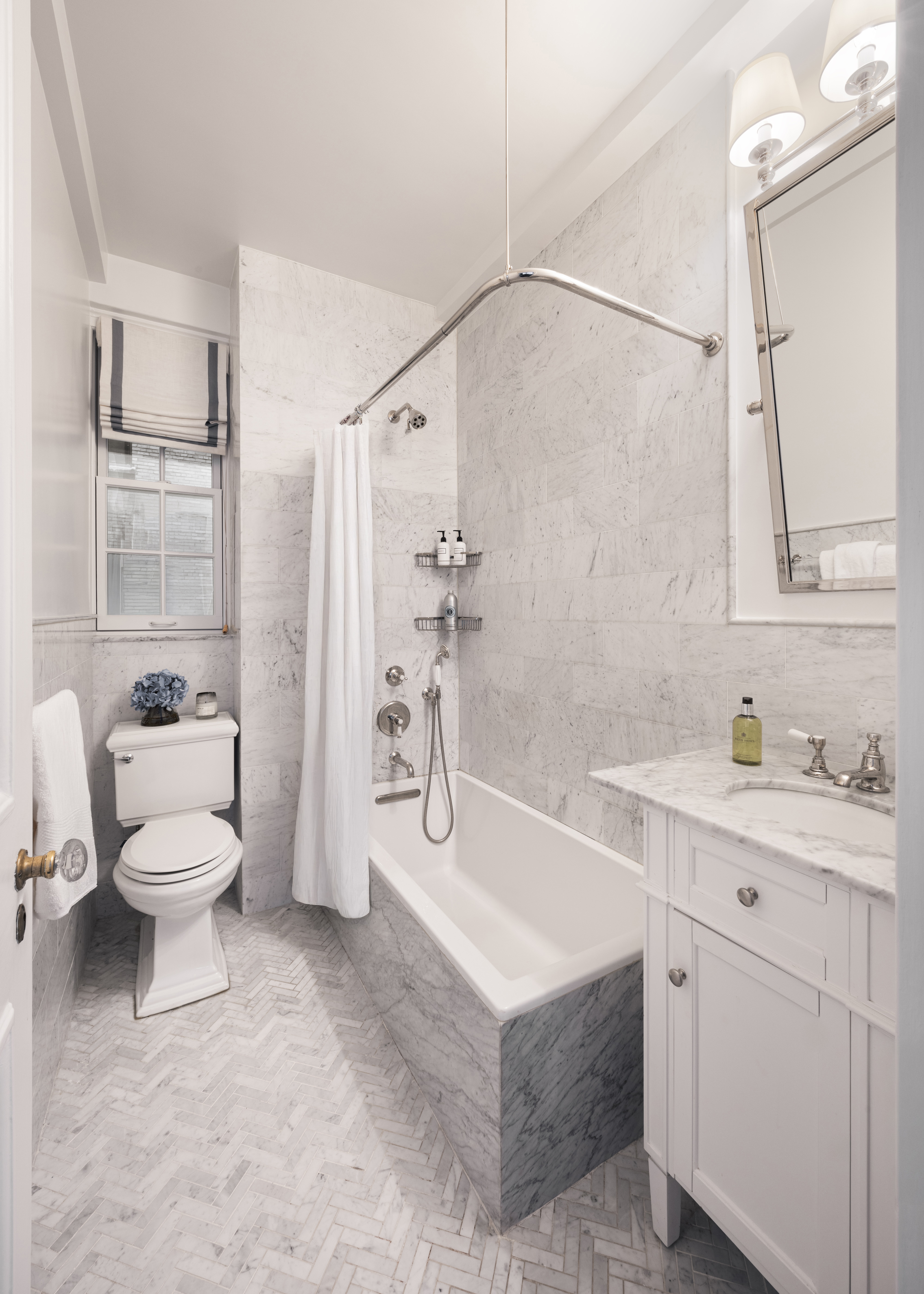 164 East 72nd Street, Unit 3B Manhattan, NY 10021 - Photo 6 of 11 a spacious bathroom with a sink toilet and shower