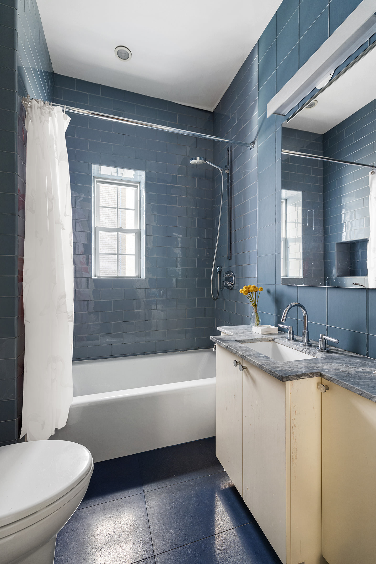 829 Park Avenue, Unit 2D/3D Manhattan, NY 10021 - Photo 16 of 21 a bathroom with a granite countertop toilet sink and bathtub