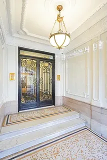 a view of a chandelier with a dining table and chandelier