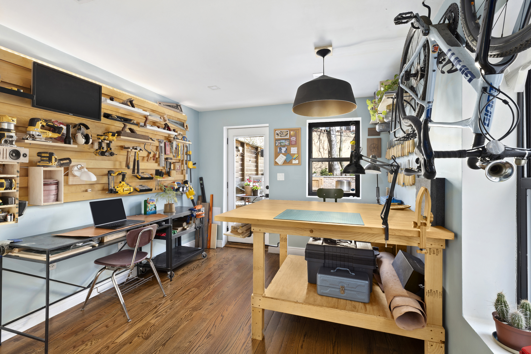 437 Putnam Avenue, Unit 1 Brooklyn, NY 11221 - Photo 5 of 12 a living room with furniture and a flat screen tv