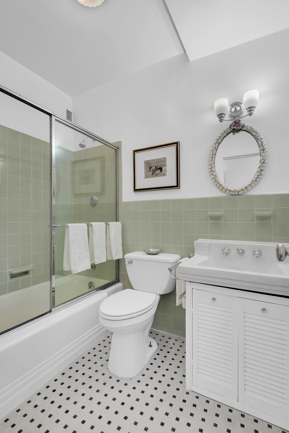 936 5th Avenue, Unit 14B Manhattan, NY 10021 - Photo 9 of 15 a bathroom with a sink toilet and shower