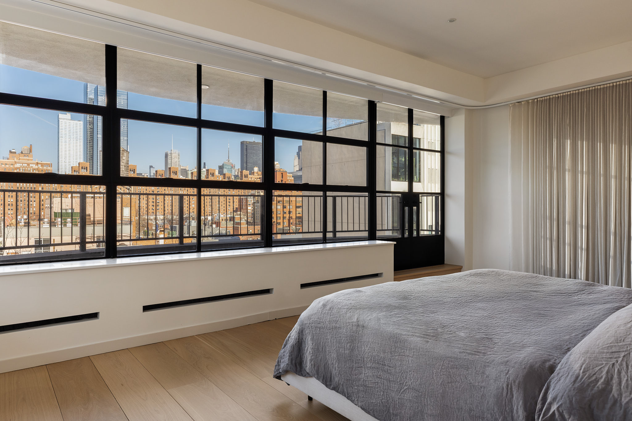 456 West 19th Street, Unit PHH Manhattan, NY 10011 - Photo 11 of 21 a bedroom with a bed and a large window