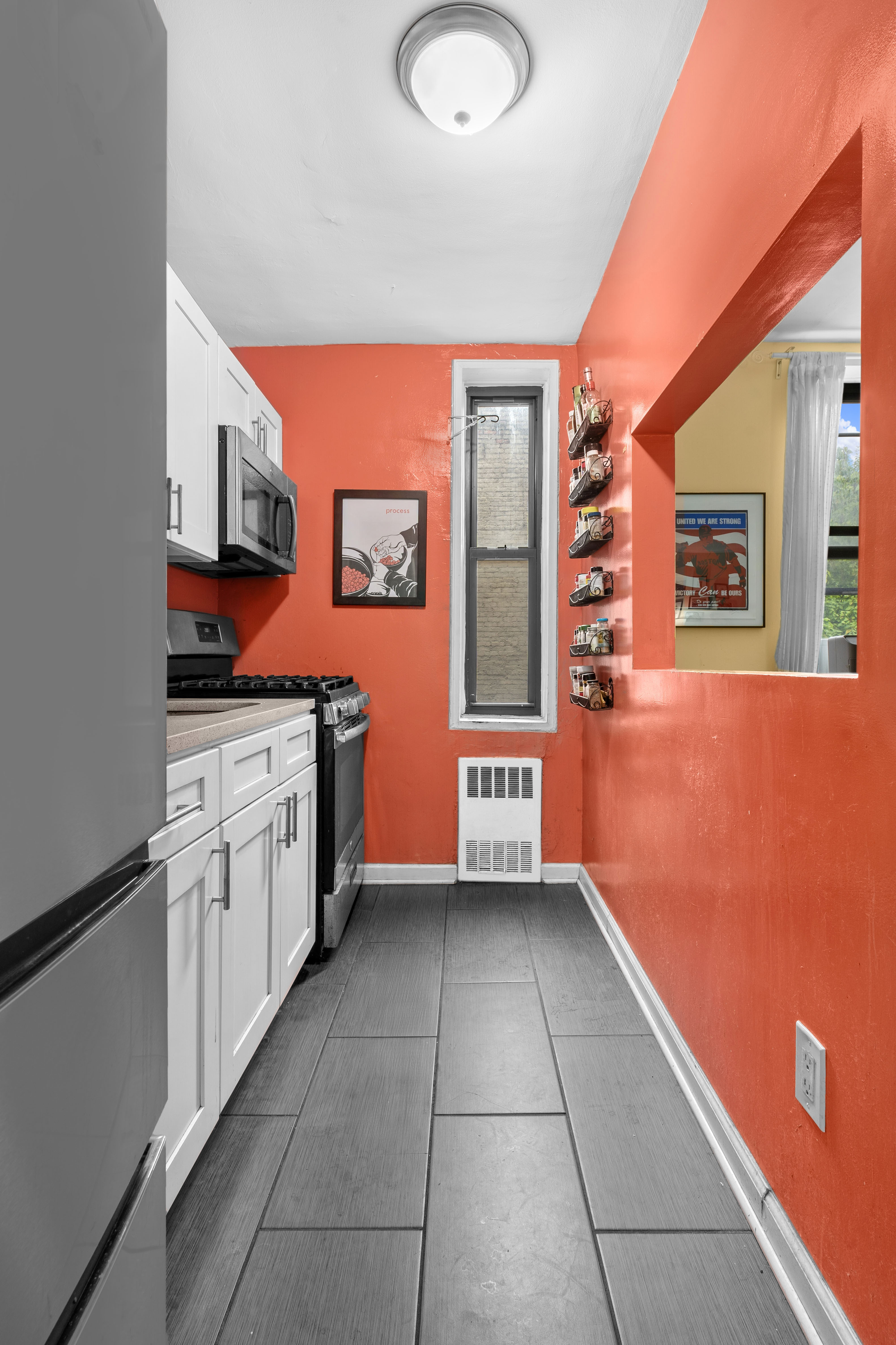 2701 Newkirk Avenue, Unit 3H Brooklyn, NY 11226 - Photo 3 of 5 a kitchen with stainless steel appliances granite countertop a stove a sink and dishwasher