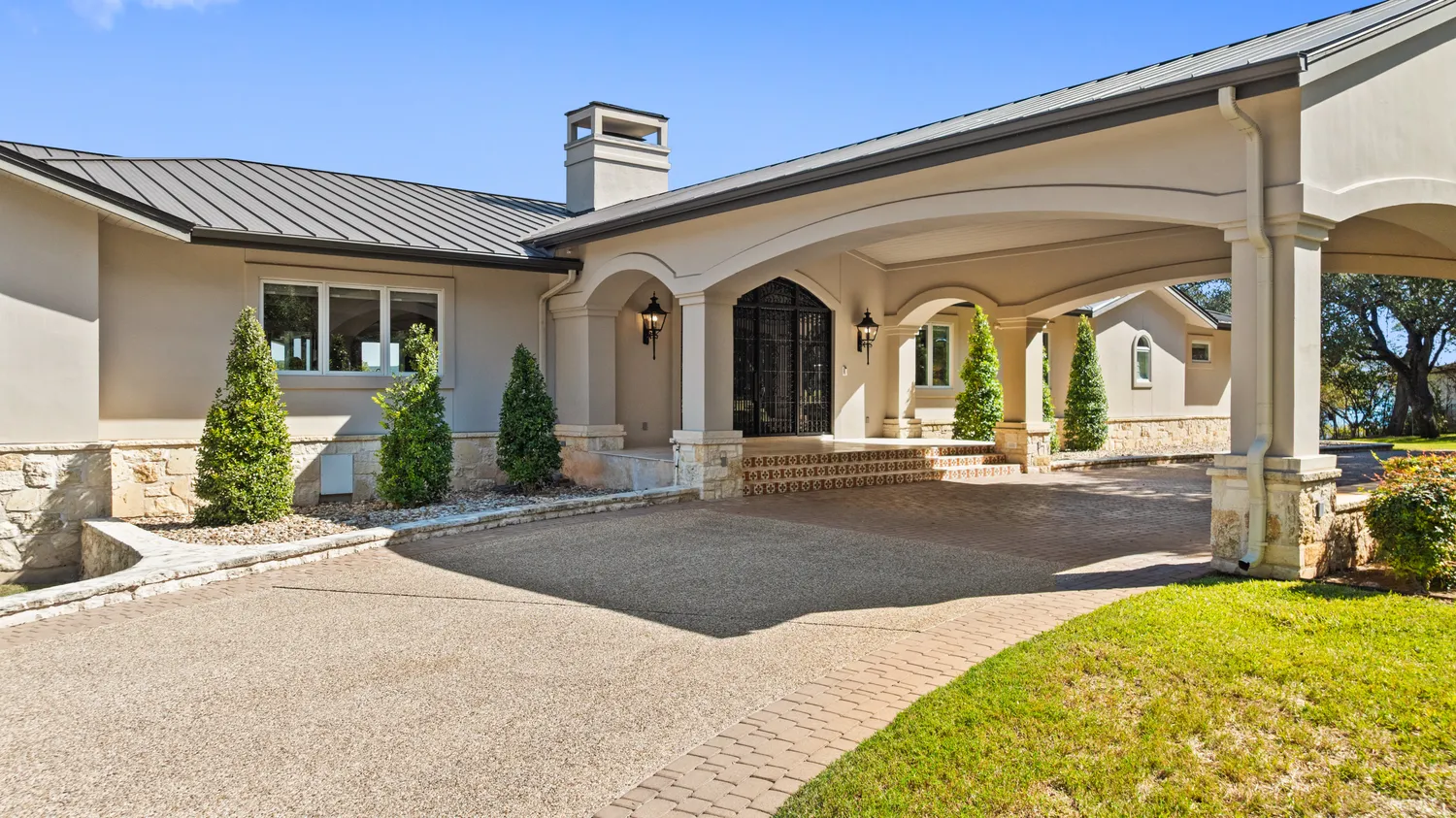 a kitchen with stainless steel appliances granite countertop a refrigerator a stove and a sink with cabinets