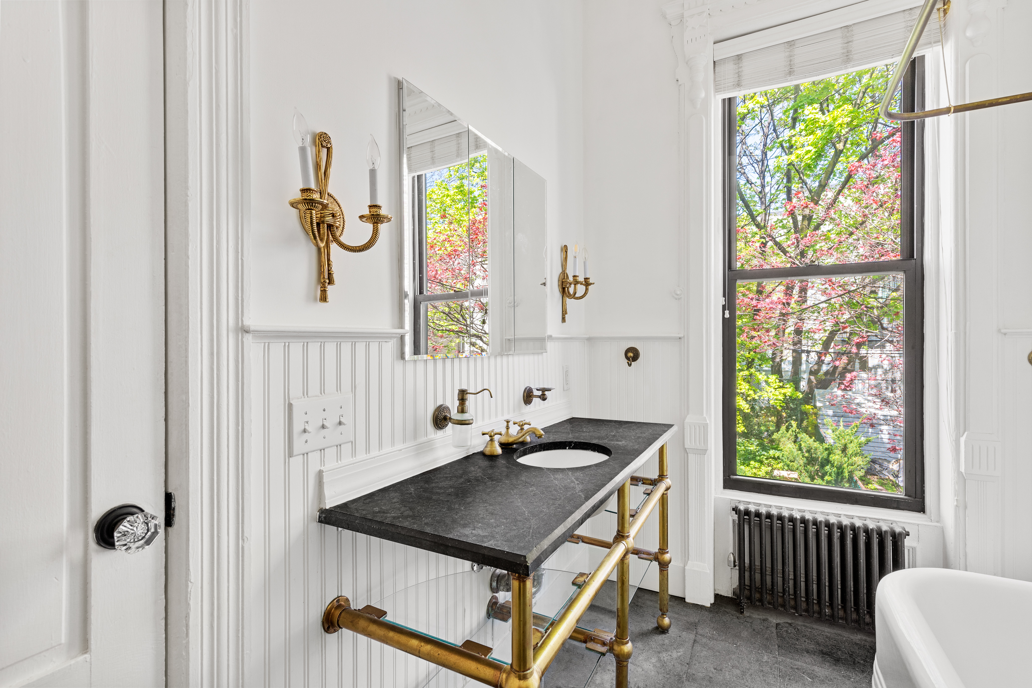 955 Bushwick Avenue Brooklyn, NY 11221 - Photo 4 of 19 a bathroom with a sink a stove and a window