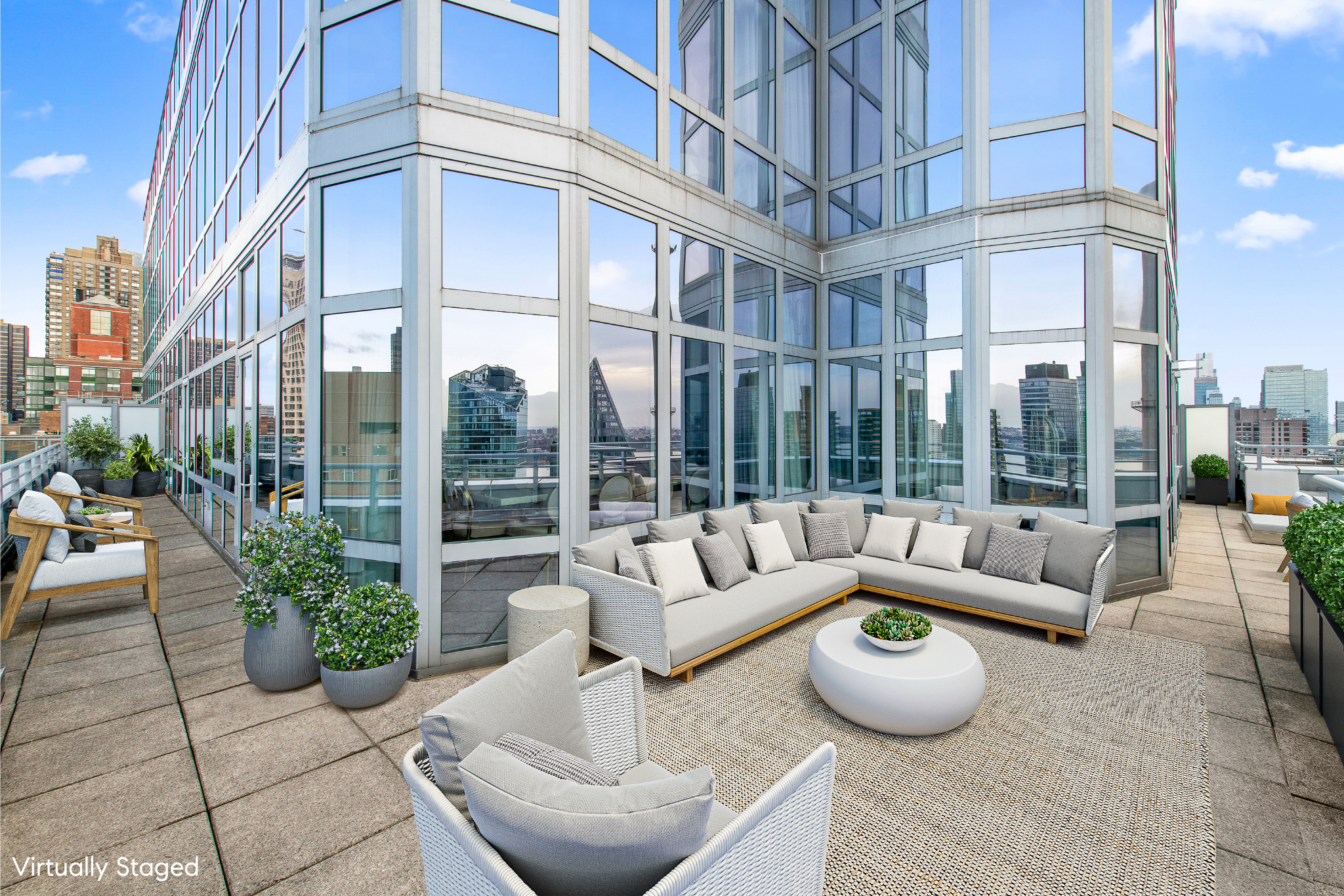 555 West 59th Street, Unit PHA Manhattan, NY 10019 - Photo 4 of 20 a view of a building with couches and potted plants