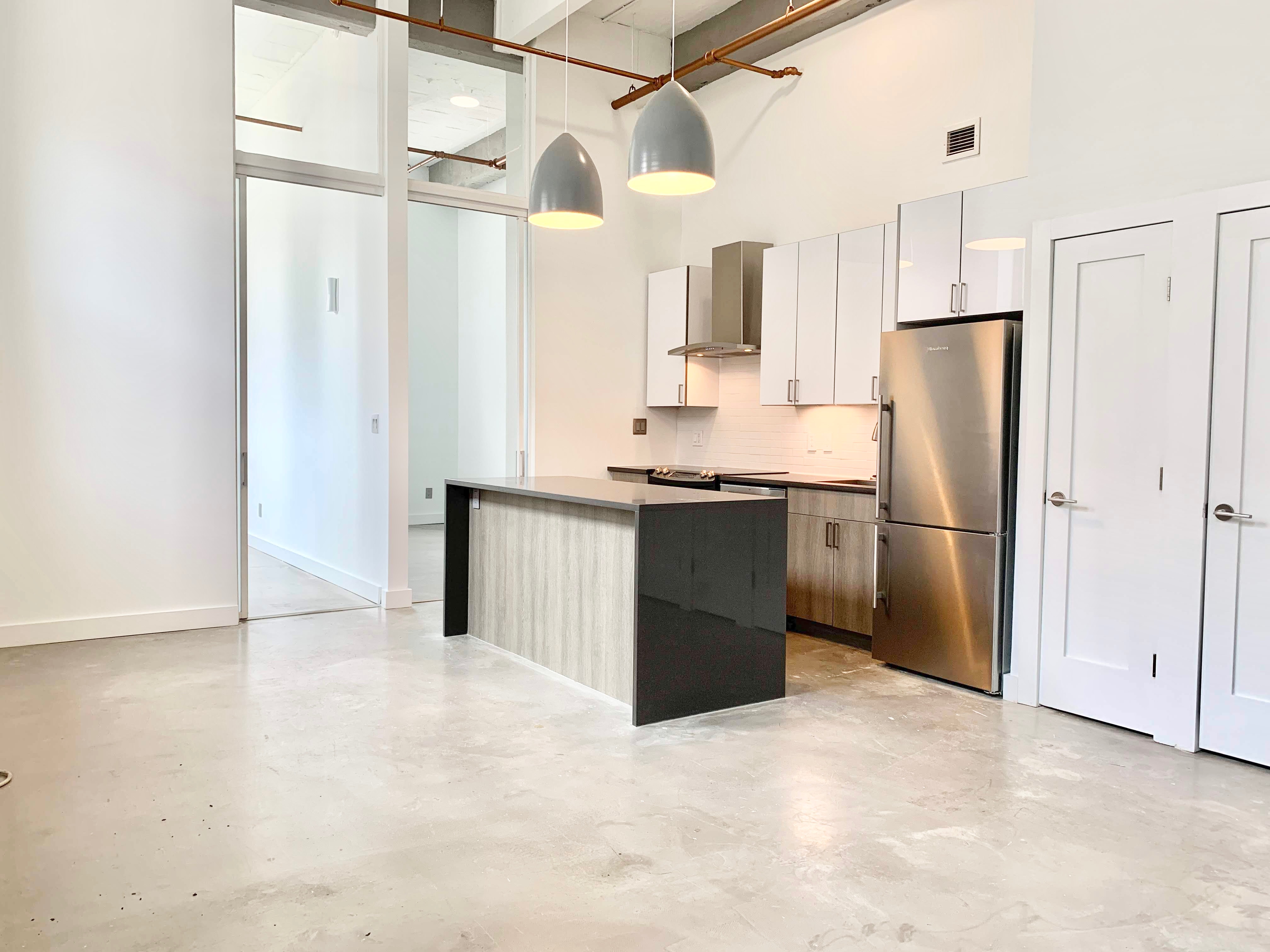 44 Berry Street, Unit 2C Brooklyn, NY 11249 - Photo 2 of 8 a kitchen with stainless steel appliances a refrigerator and a cabinets