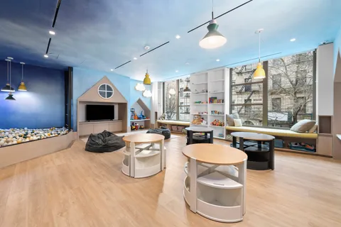 a kitchen with sink a stove and furniture