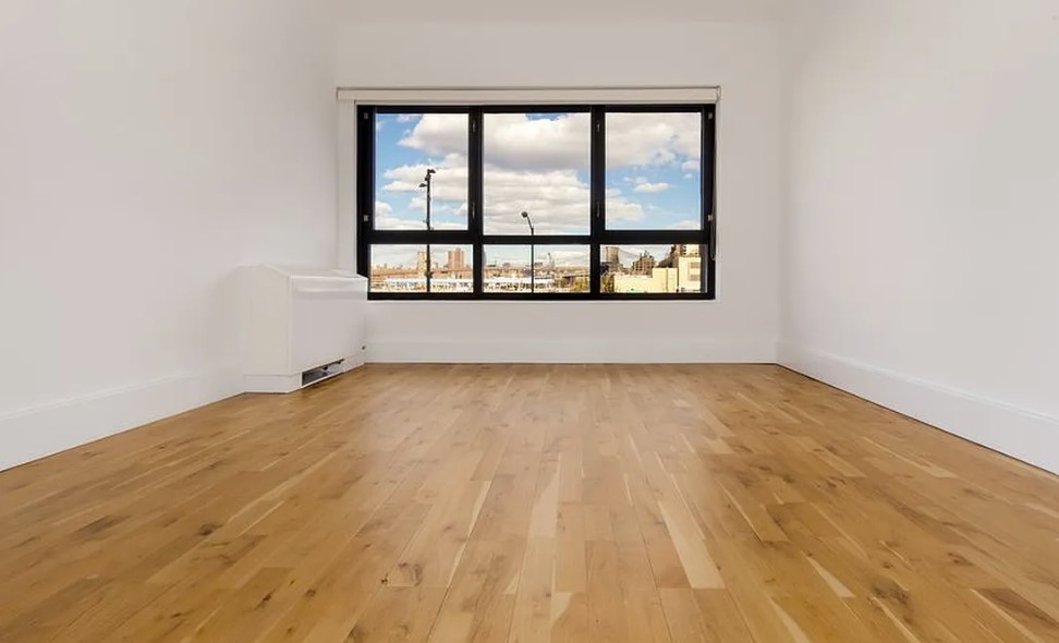 360 Furman Street, Unit 221 Brooklyn, NY 11201 - Photo 4 of 36 an empty room with a window