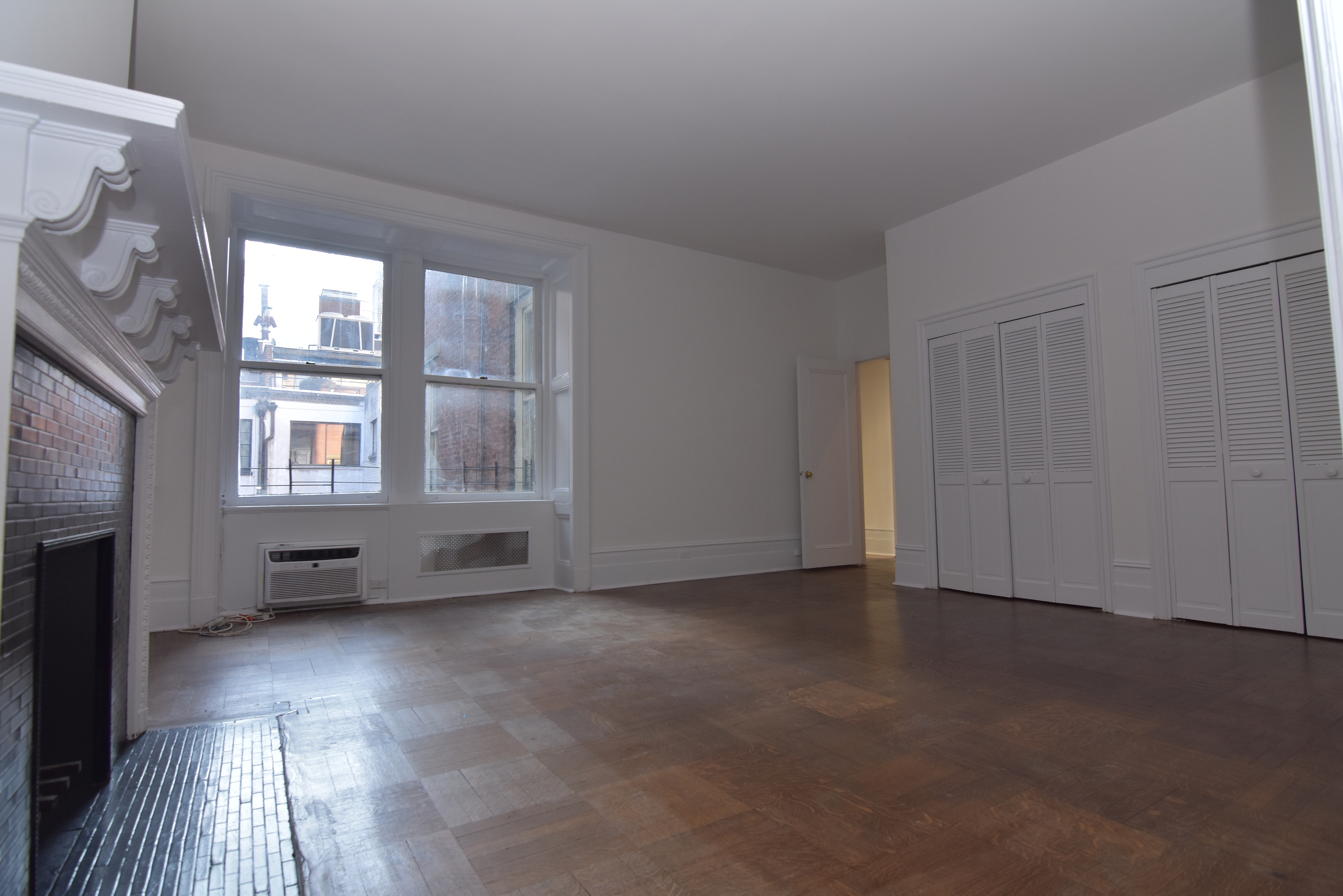 18 East 67th Street, Unit 2B/3B Manhattan, NY 10065 - Photo 12 of 18 a view of an empty room with a window