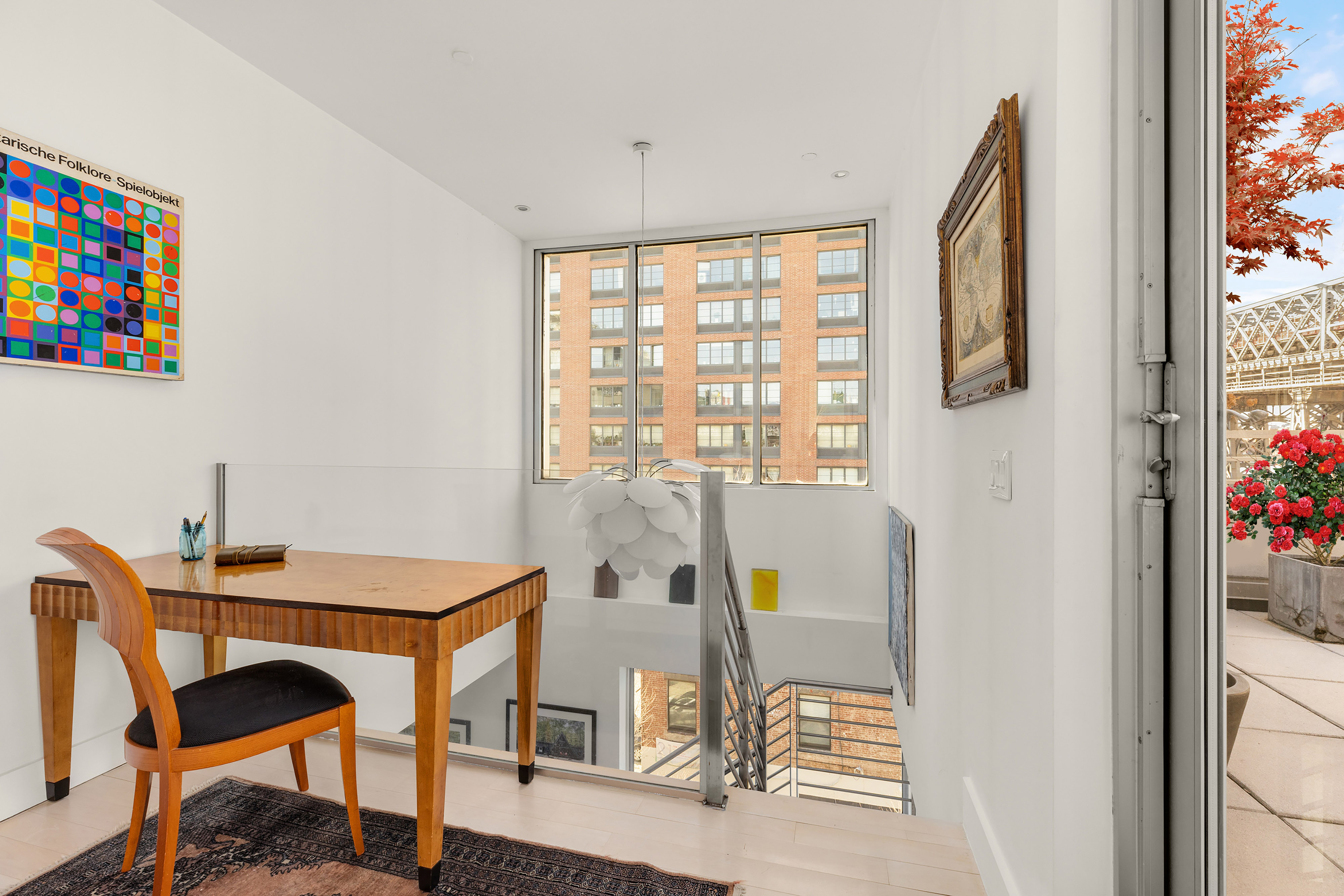 24 Dunham Place, Unit PHA Brooklyn, NY 11249 - Photo 11 of 19 a view of a dining room with furniture and a window