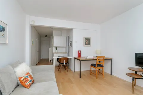 a workspace with furniture and window