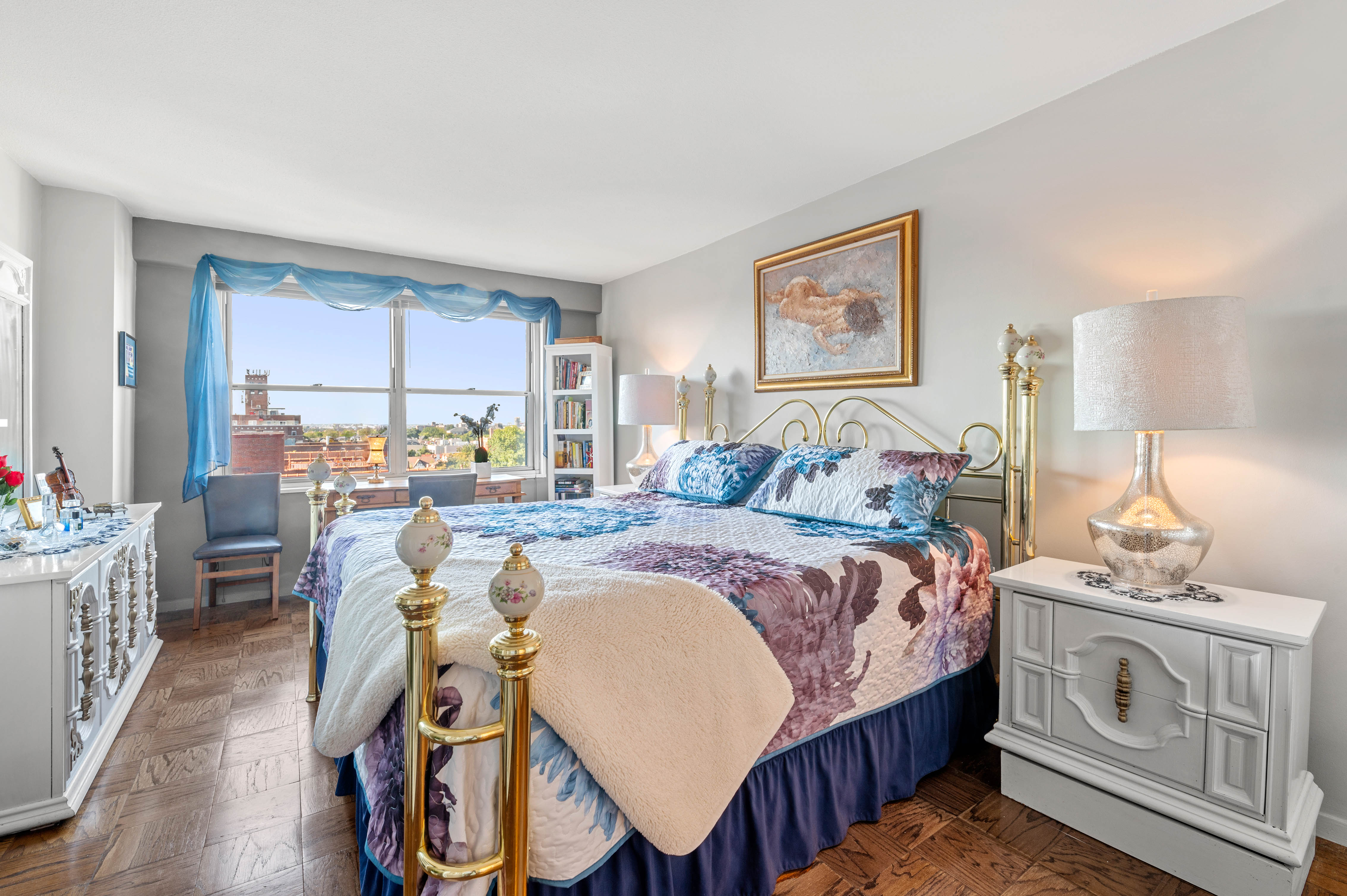 70-31 108th Street, Unit 9C Queens, NY 11375 - Photo 4 of 11 a bedroom with bed a table and chair