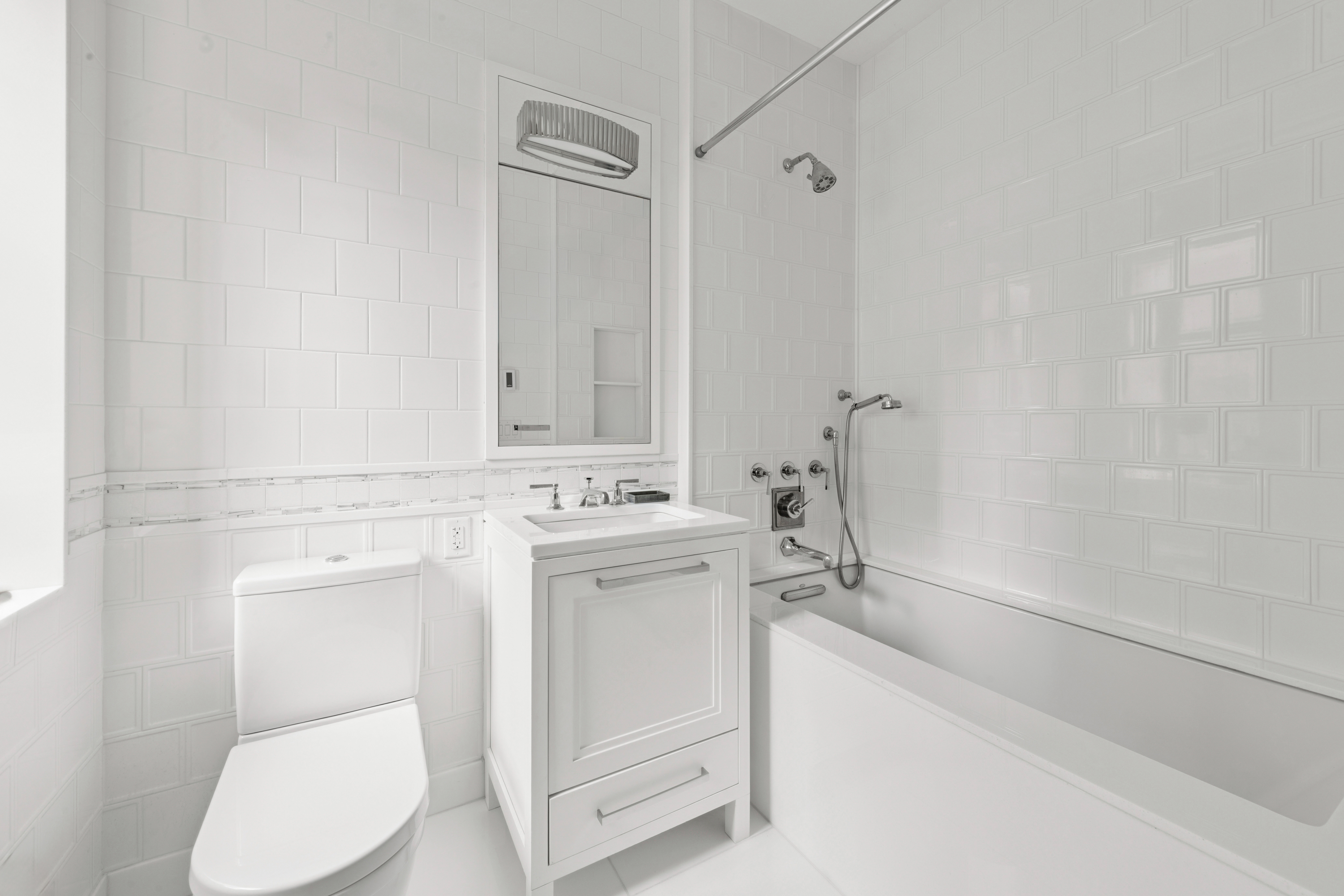 235 West 75th Street, Unit 507 Manhattan, NY 10023 - Photo 8 of 14 a bathroom with a sink a toilet and shower
