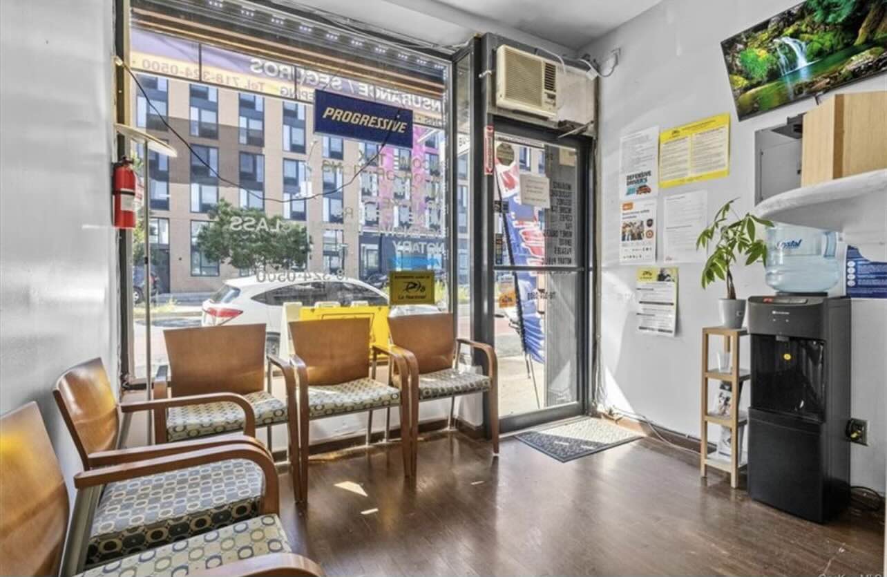 3194 Webster Avenue Bronx, NY 10467 - Photo 17 of 23 a living room with furniture and a floor to ceiling window