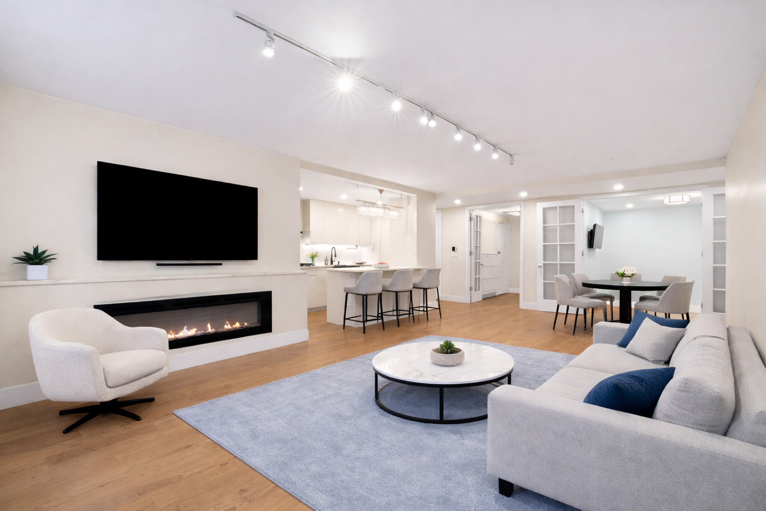70 East 10th Street, Unit 4V Manhattan, NY 10003 - Photo 3 of 26 a living room with furniture and a flat screen tv
