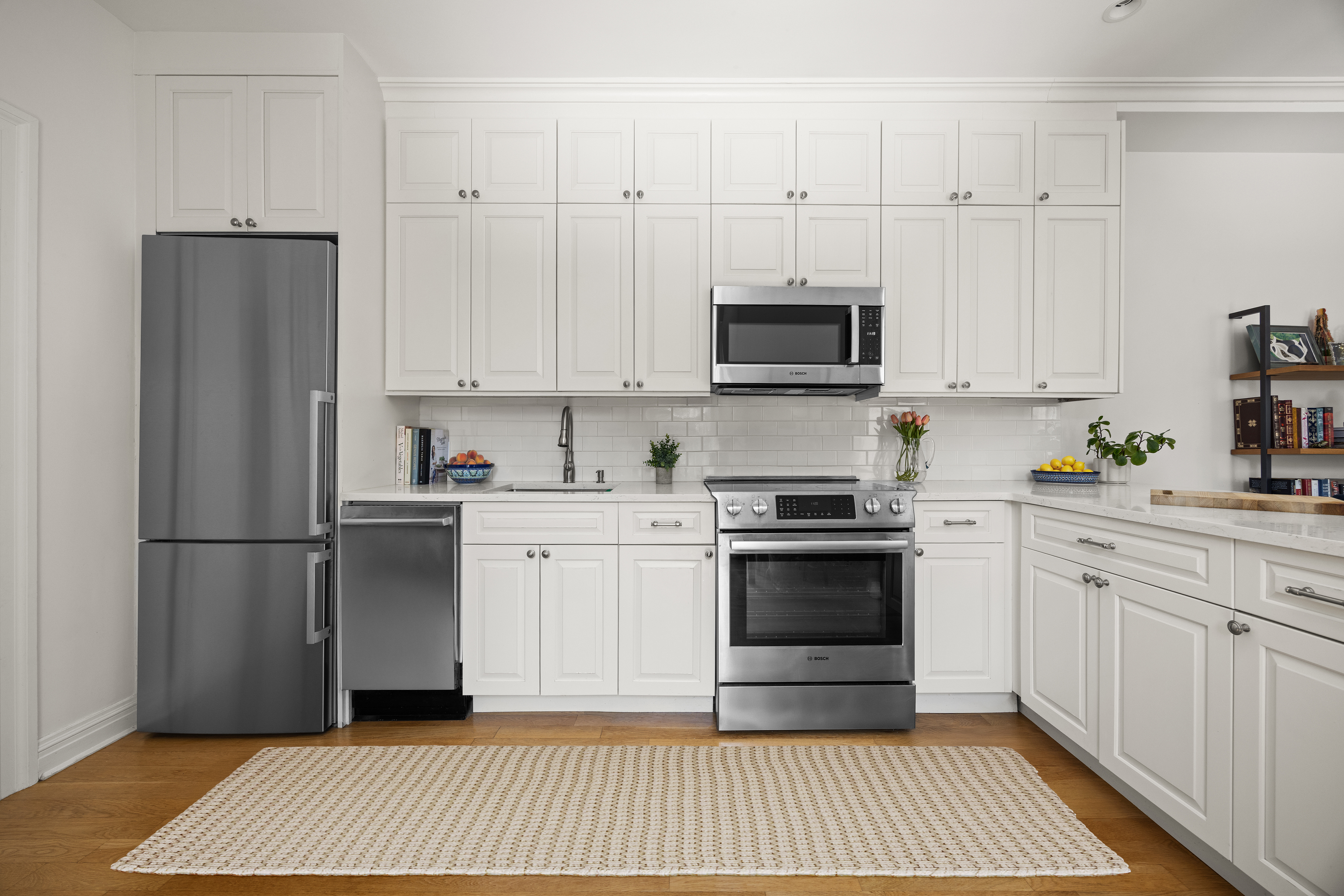 570 7th Street, Unit 3B Brooklyn, NY 11215 - Photo 3 of 9 a kitchen with stainless steel appliances granite countertop a refrigerator stove a sink and white cabinets