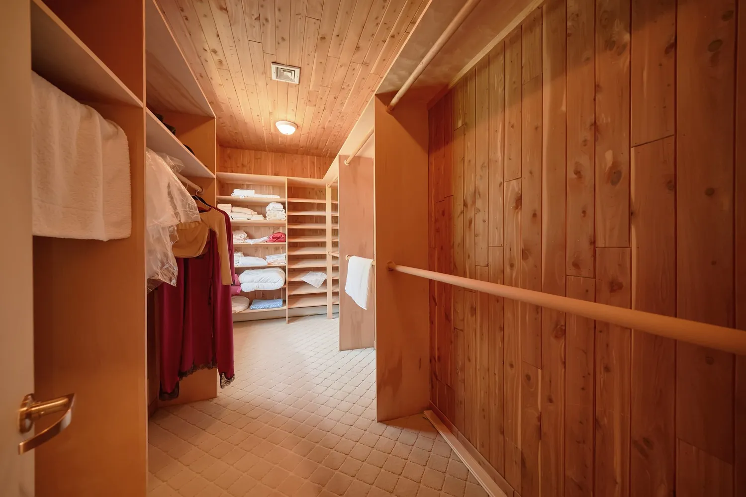 a bedroom with a large bed and a couch