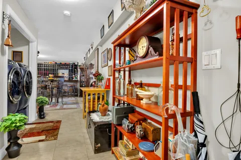 a view of a house with backyard porch and sitting area