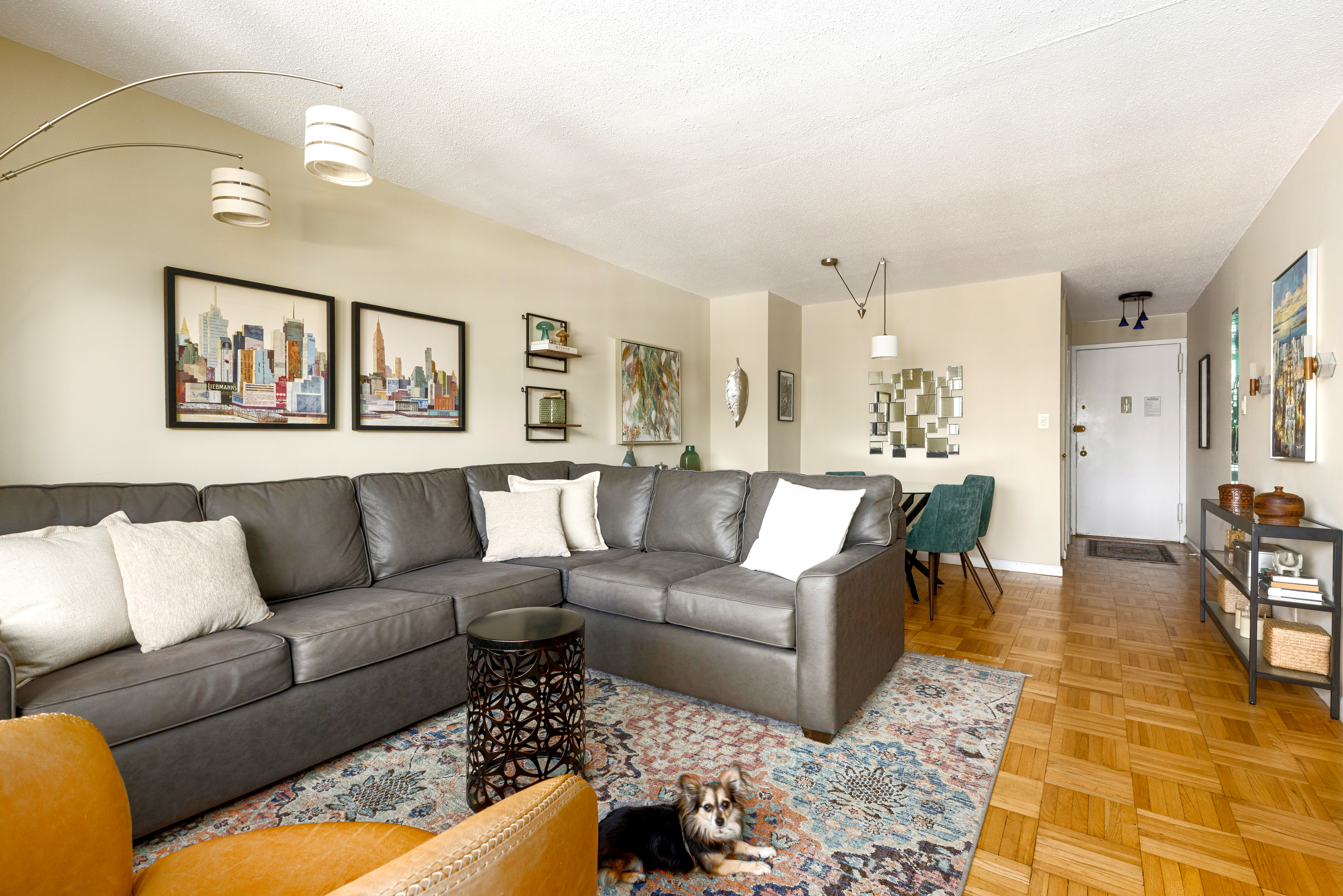 201 West 70th Street, Unit 17A Manhattan, NY 10023 - Photo 2 of 20 a living room with furniture and kitchen view