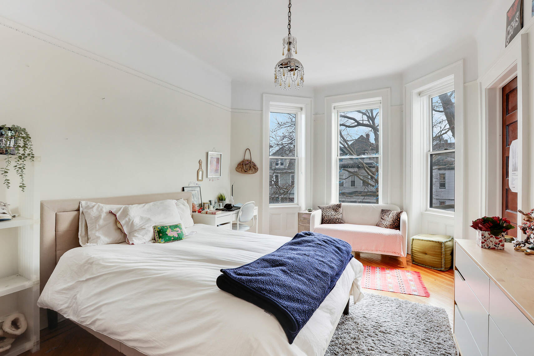 261 Fenimore Street Brooklyn, NY 11225 - Photo 13 of 21 a bedroom with a bed and glass window