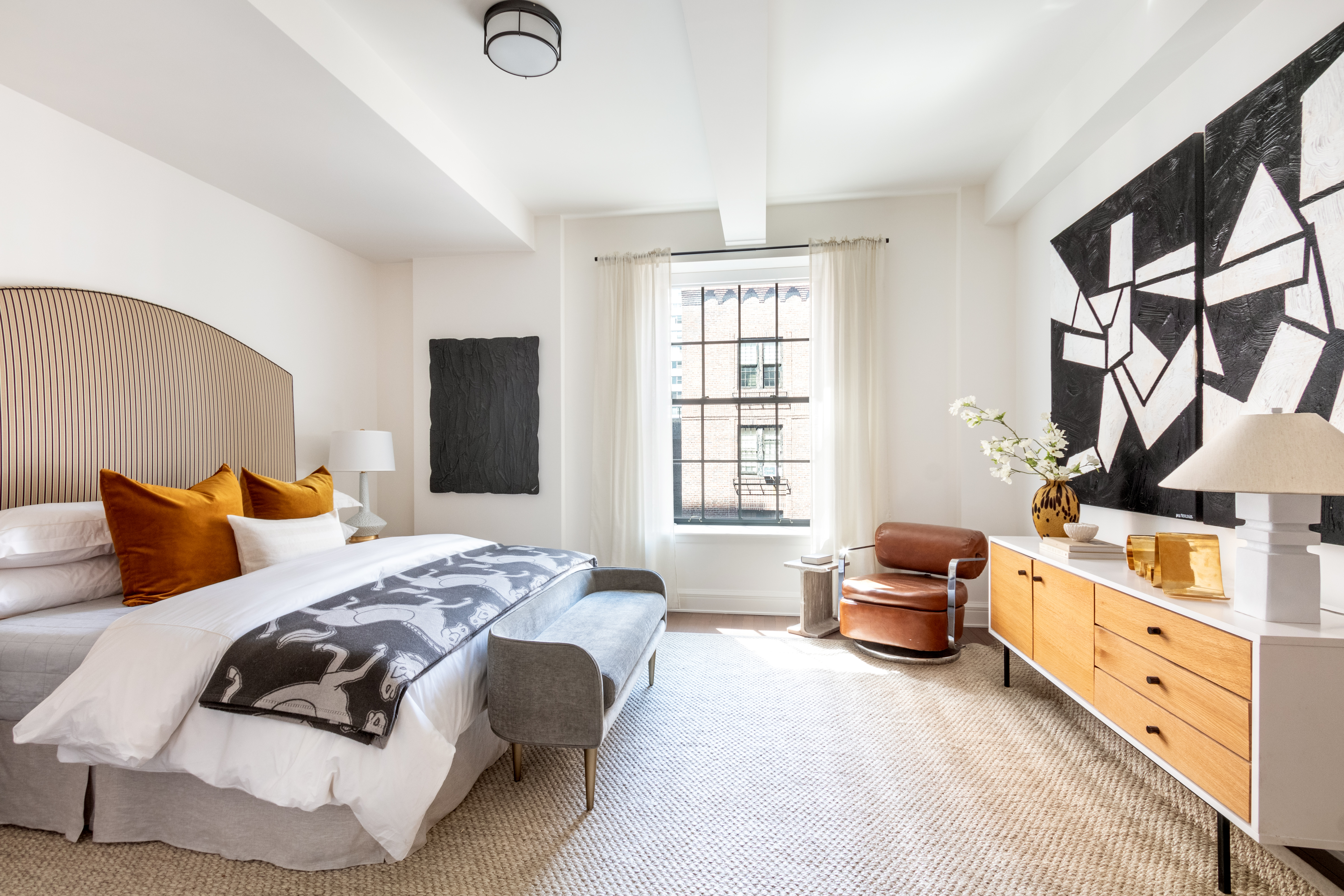 160 West 12th Street, Unit 56 Manhattan, NY 10011 - Photo 5 of 18 a bedroom with bed couch and window