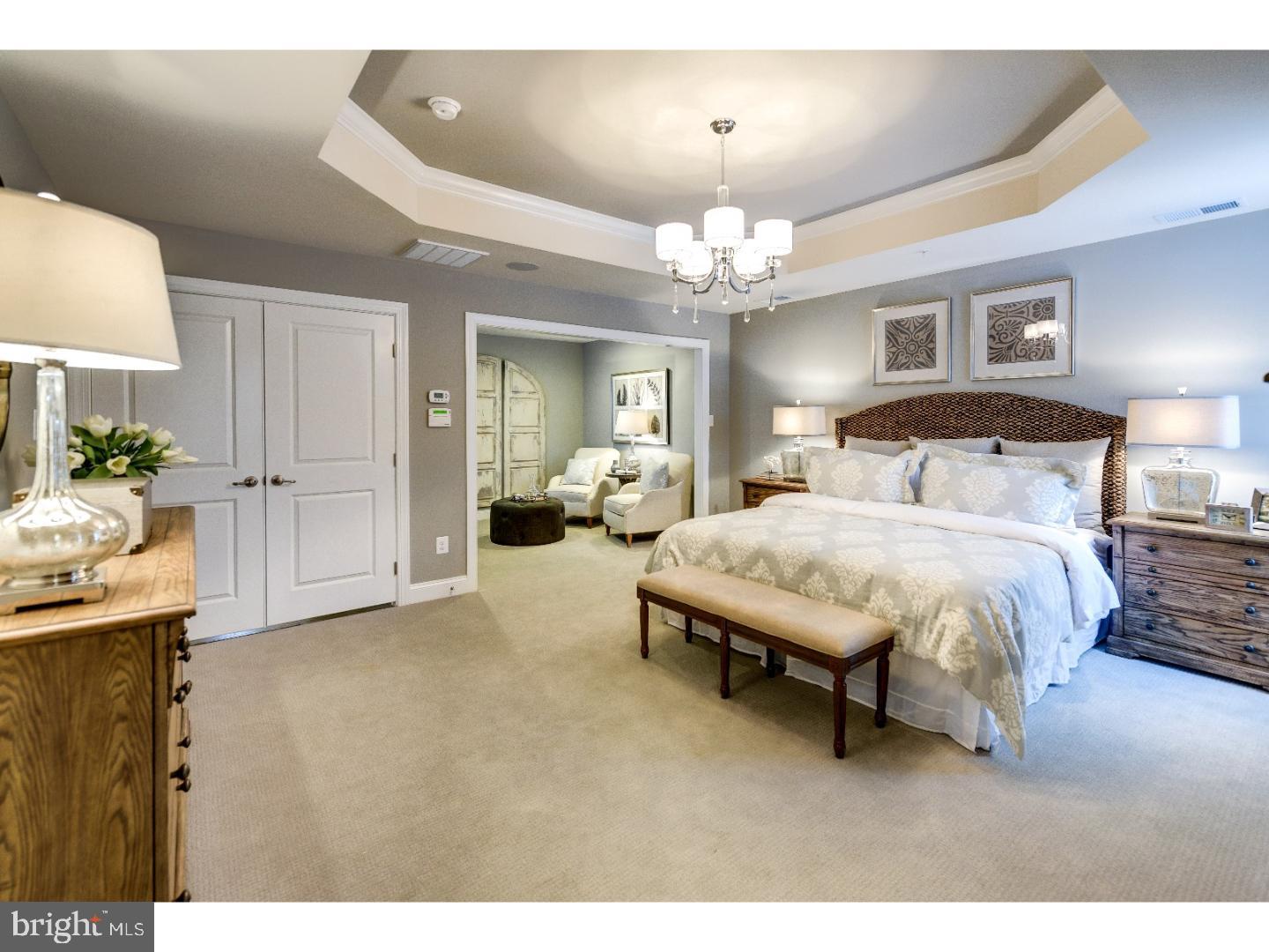 407 Quarry Point Road Malvern, PA 19355 - Photo 13 of 14 a spacious bedroom with a bed mirror and window