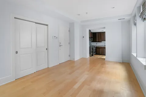 a big room with closet and a bathroom