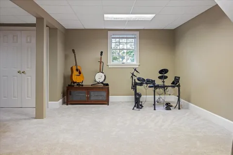 an aerial view of a house with yard swimming pool and outdoor seating