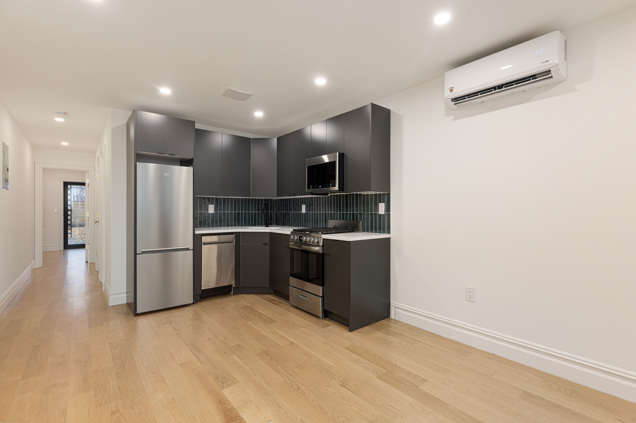 15 Verona Place, Unit GARDEN Brooklyn, NY 11216 - Photo 3 of 14 a kitchen with stainless steel appliances a refrigerator and a sink
