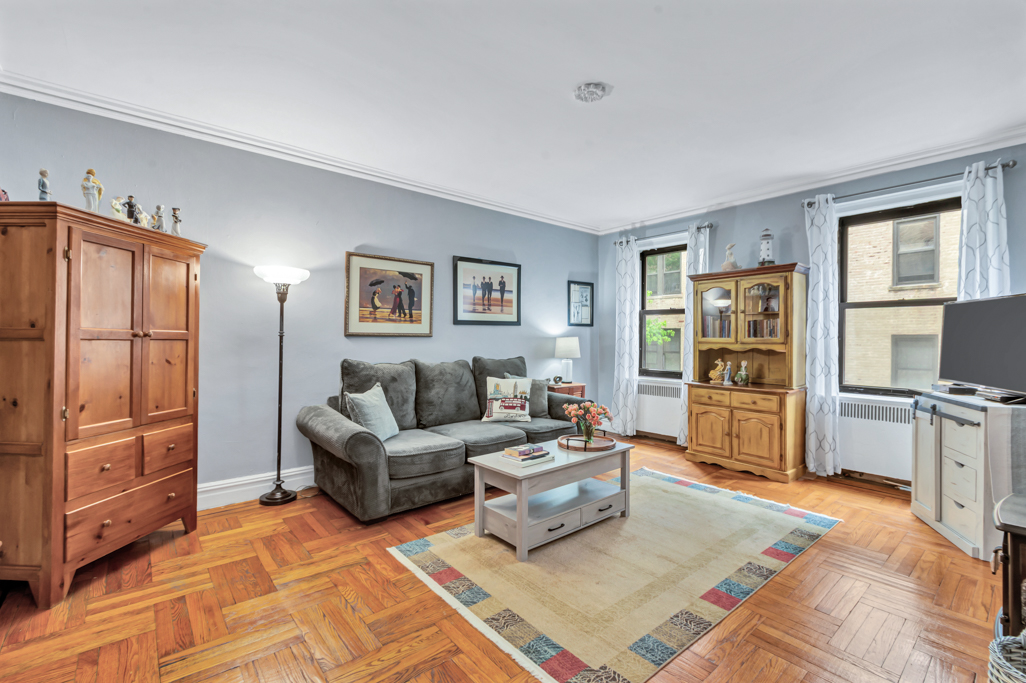 350 Cabrini Boulevard, Unit 6N Manhattan, NY 10040 - Photo 1 of 9 a living room with furniture and a flat screen tv