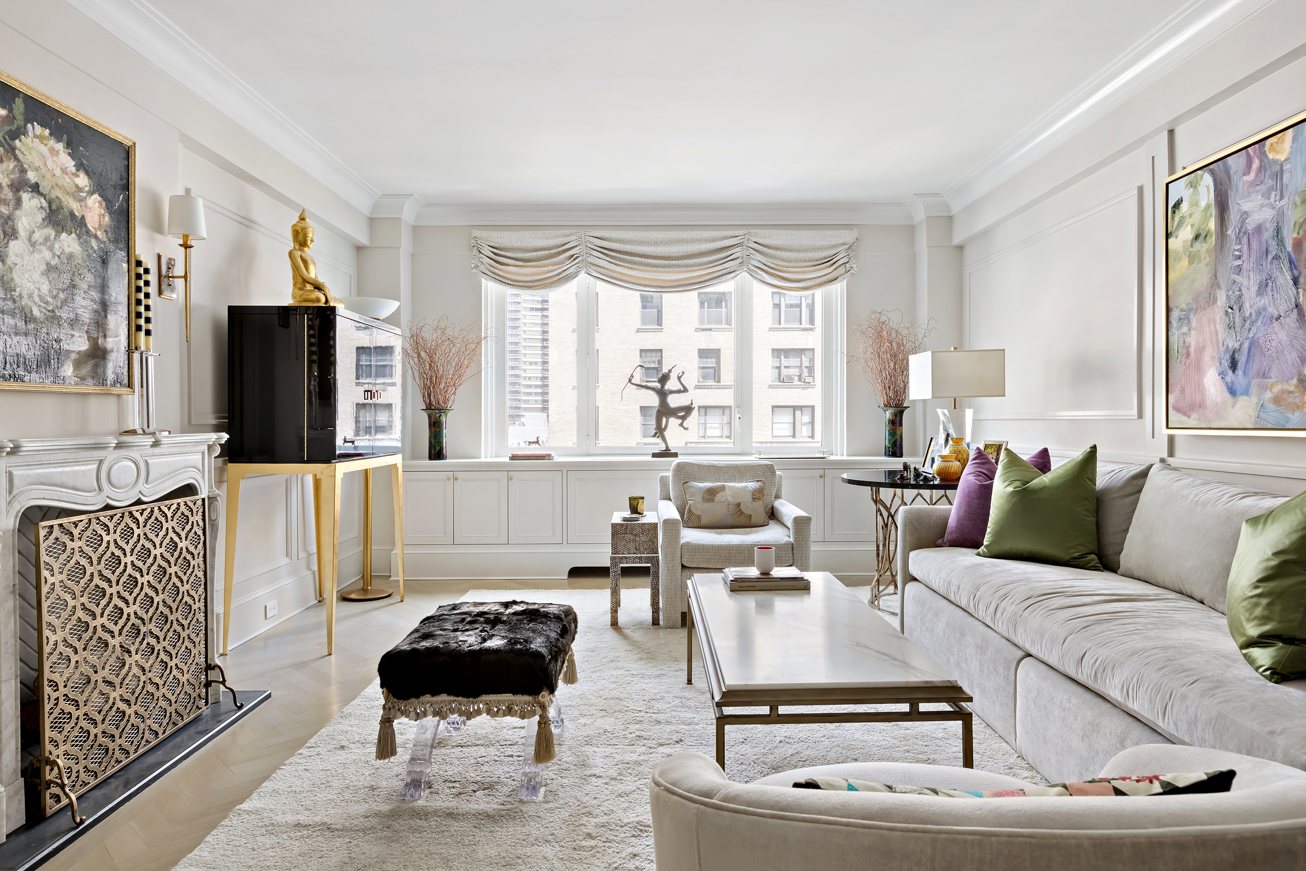 530 Park Avenue, Unit 10D Manhattan, NY 10065 - Photo 2 of 13 a living room with furniture and a large window