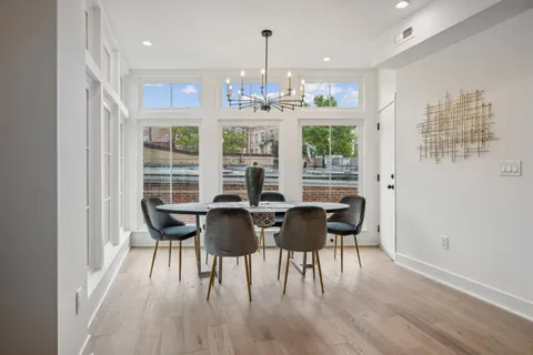 a view of a dining room with furniture window and outside view