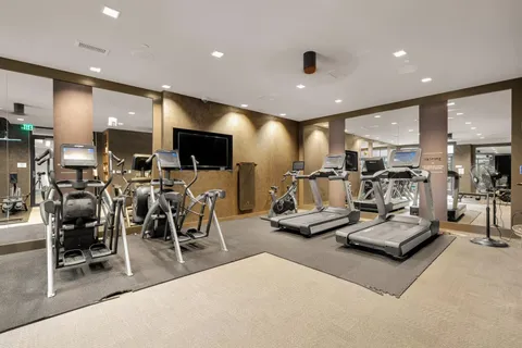 a large kitchen with lots of counter space and stainless steel appliances