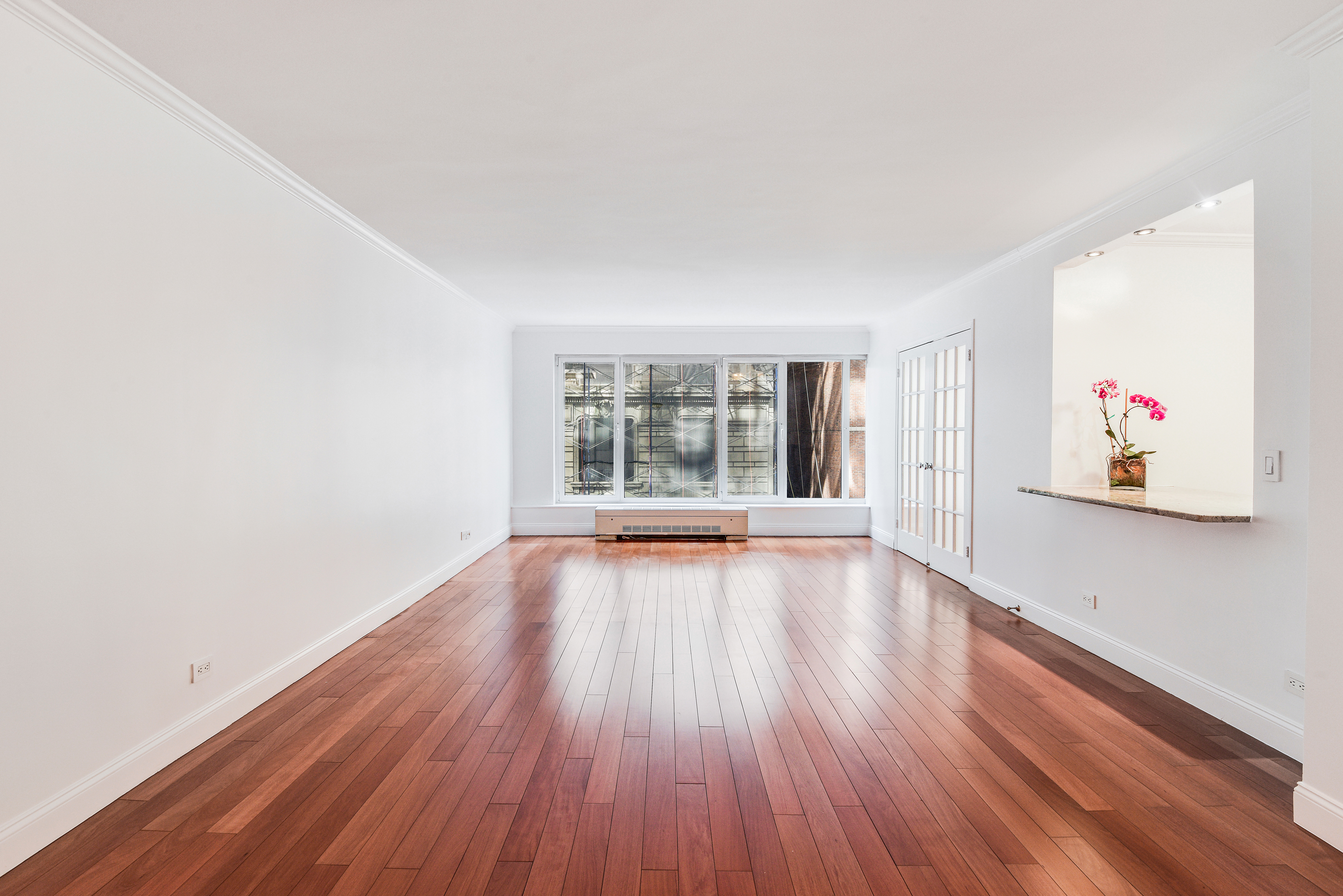 200 Central Park South, Unit 5M Manhattan, NY 10019 - Photo 6 of 15 an empty room with wooden floor and windows
