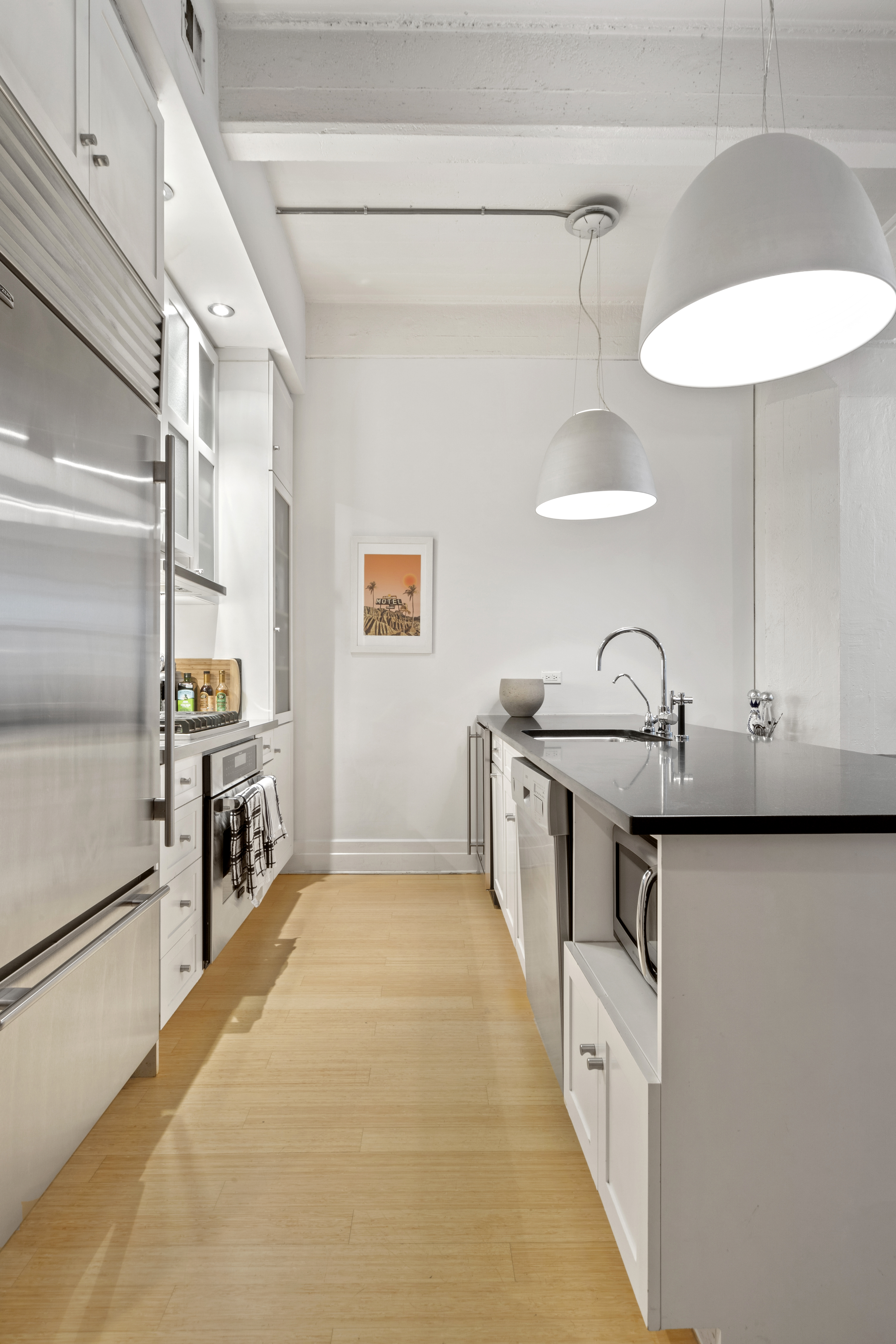70 Washington Street, Unit 2T Brooklyn, NY 11201 - Photo 3 of 11 a kitchen with stainless steel appliances a sink a stove and refrigerator