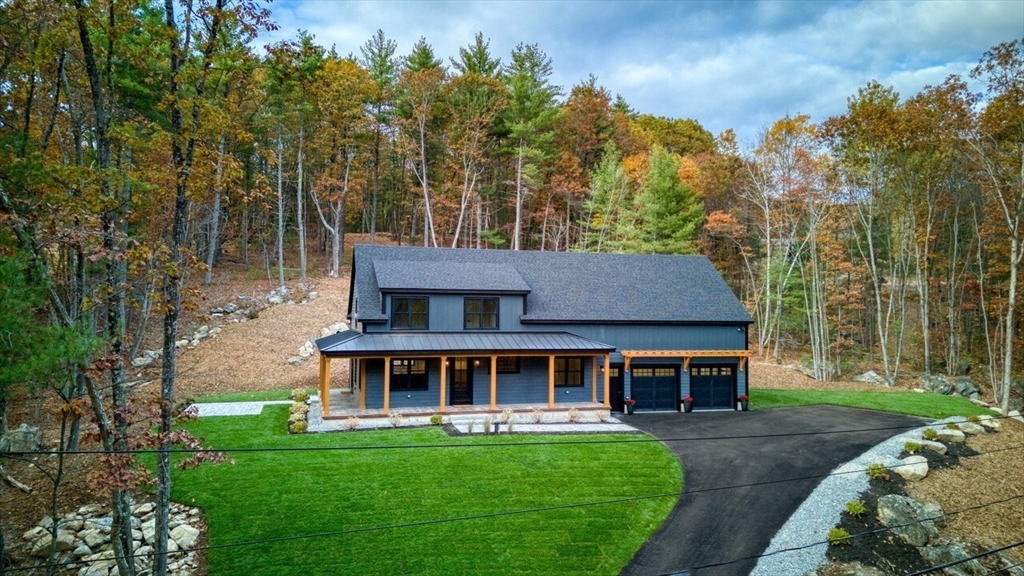 171 Randall Road Berlin, MA 01503 - Photo 39 of 41 a front view of a house with garden