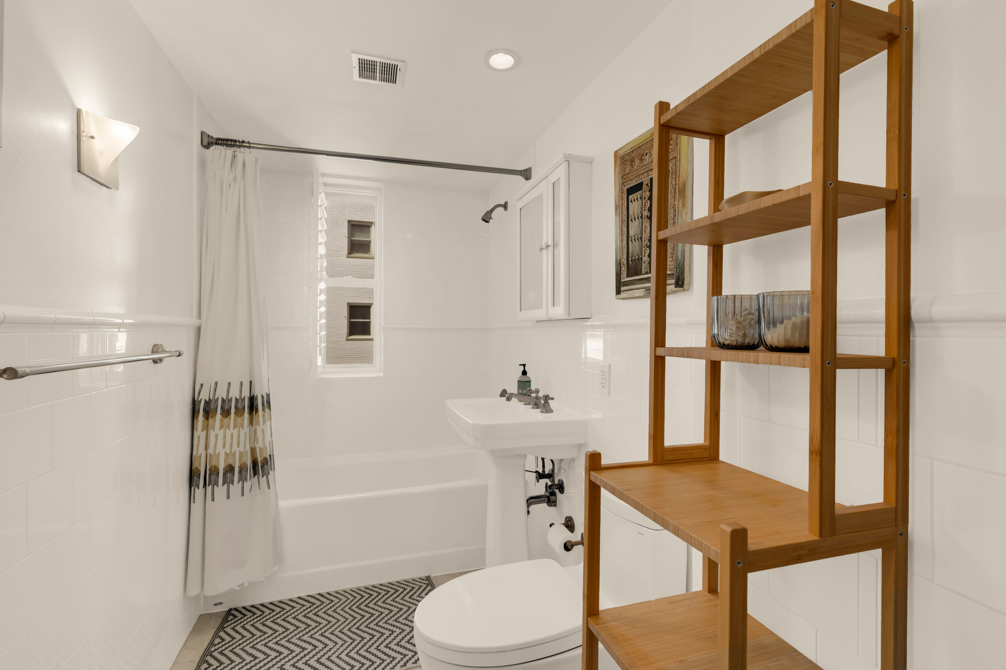 2127 California Street Northwest, Unit 505 Washington, DC 20008 - Photo 27 of 40 a bathroom with a sink a toilet and shower