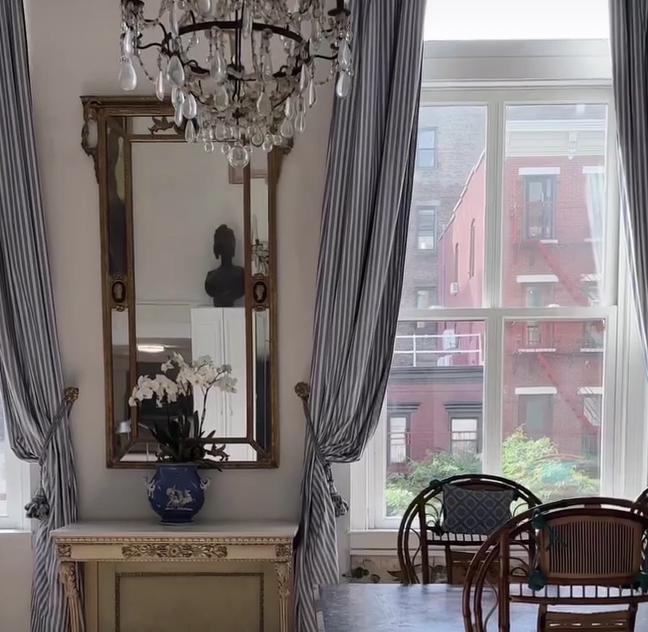 240 Centre Street, Unit 3B Manhattan, NY 10013 - Photo 8 of 23 a table with a vase and flowers sitting on a table