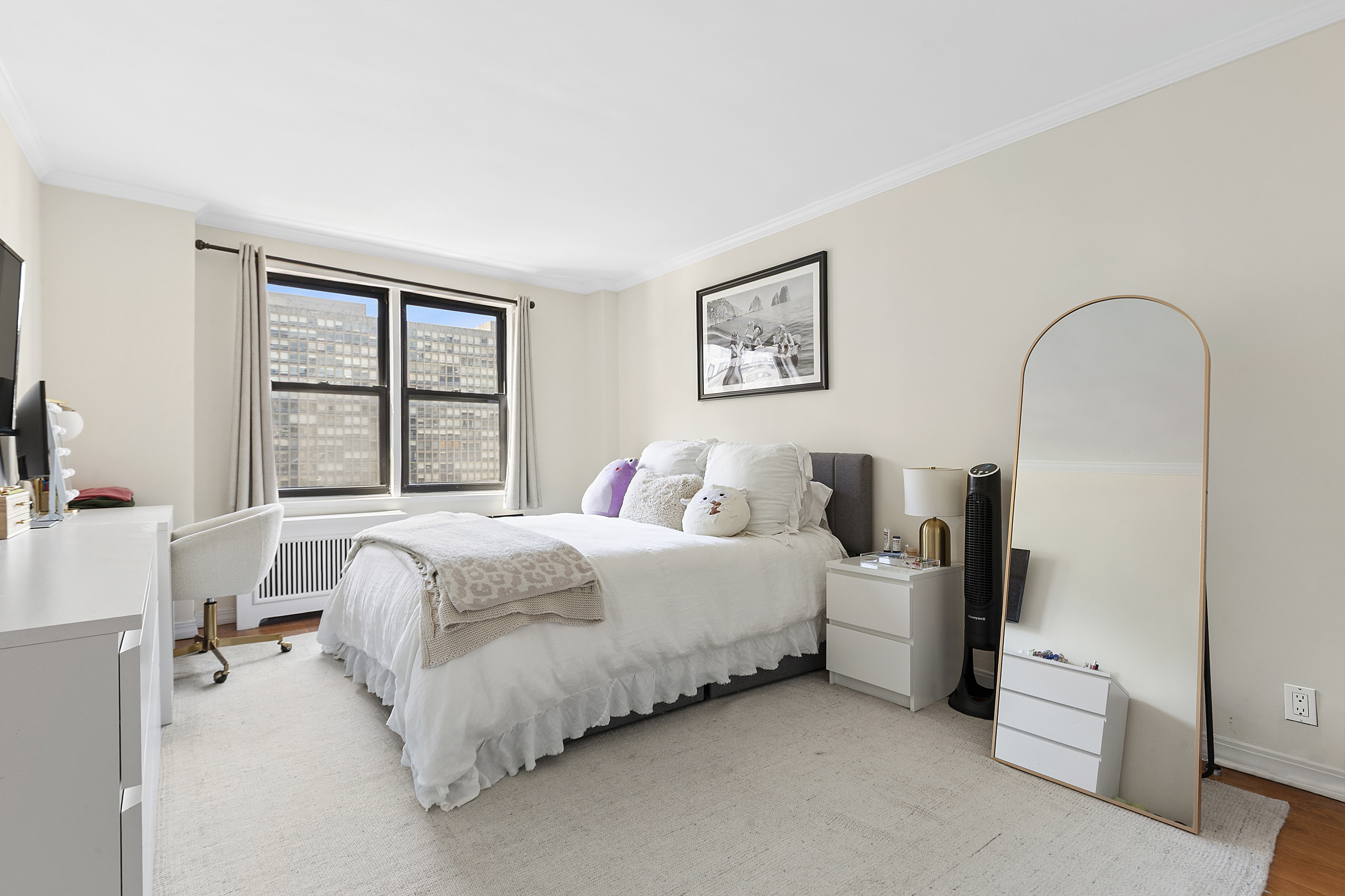 333 East 34th Street, Unit 14J Manhattan, NY 10016 - Photo 5 of 10 a bed room with a bed and a window